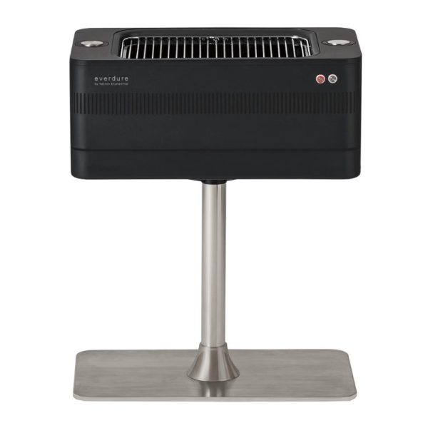 Everdure black portable charcoal grill on a stainless steel stand, featuring a sleek design and grilling surface for outdoor cooking.