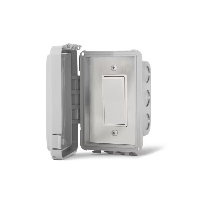 Gray electrical switch in a protective outdoor enclosure, showcasing a toggle design and secure mounting features.