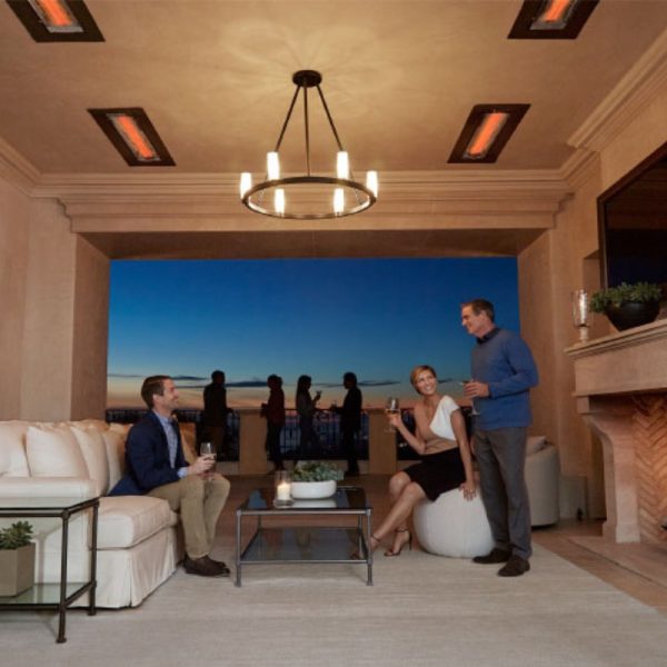 Modern outdoor living space featuring two couples enjoying drinks, stylish furniture, and a stunning sunset view. Warm lighting and cozy ambiance create an inviting atmosphere for social gatherings.