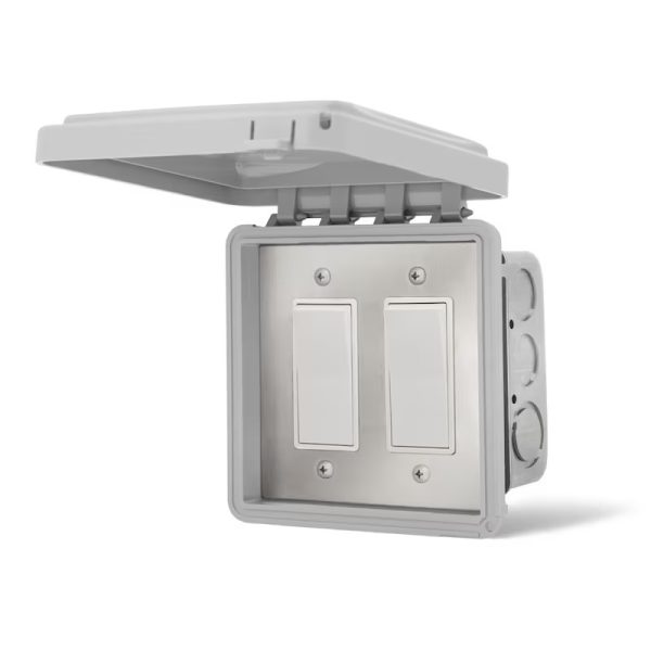 Weatherproof electrical switch box with two switches and a hinged lid for outdoor use.