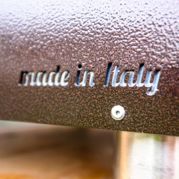 Close-up of a textured surface featuring the phrase "made in Italy," highlighting craftsmanship and quality in Italian design.