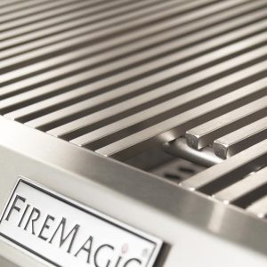 Close-up of a FireMagic stainless steel grill surface with evenly spaced grates designed for efficient cooking and heat distribution.