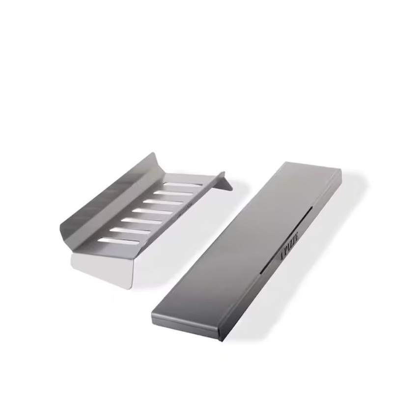 Stainless steel grilling accessories, including a slotted grilling tray and a flat cooking surface, designed for outdoor cooking and barbecue.