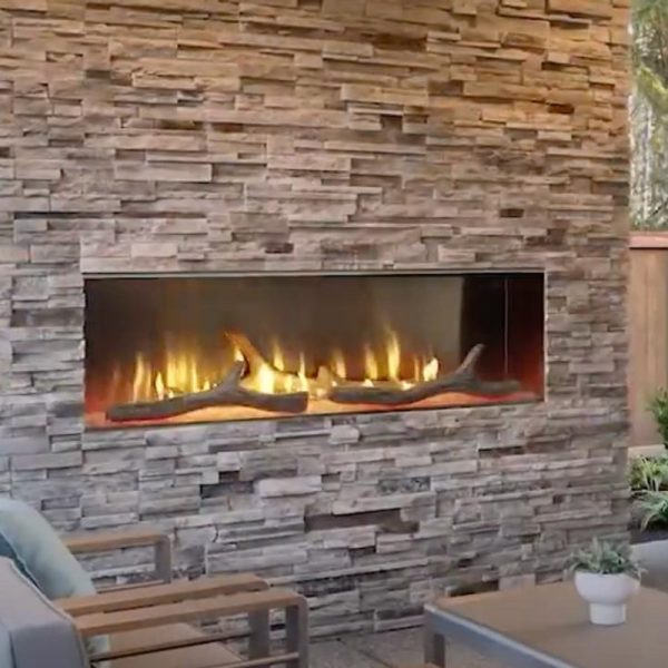 Modern outdoor fireplace with a stone wall, featuring a sleek design and glowing flames, creating a cozy ambiance for outdoor living spaces.