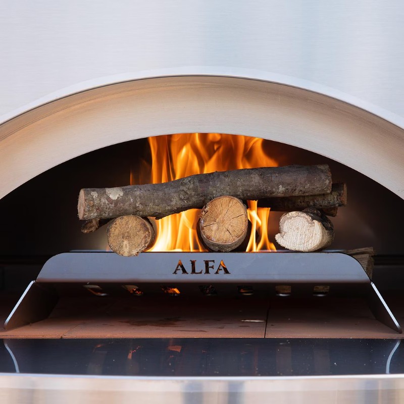 Wood logs burning in an Alfa pizza oven, showcasing vibrant flames and a stainless steel interior.