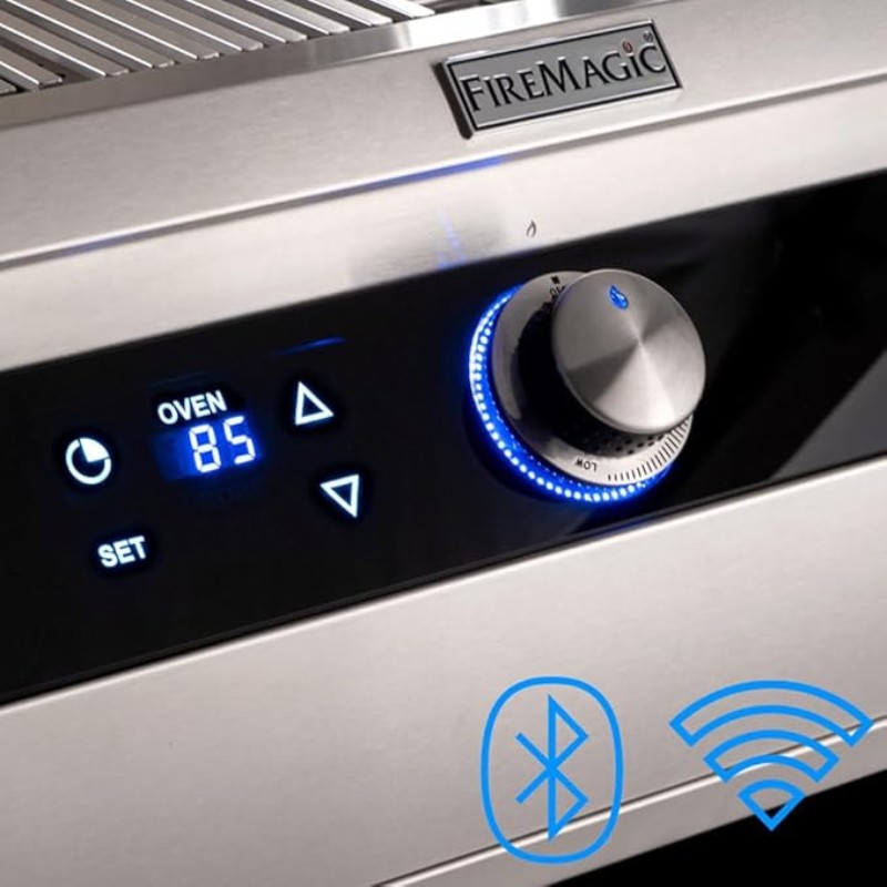 Close-up of a FireMagic grill control panel featuring an oven temperature display set to 85, with Bluetooth and Wi-Fi connectivity icons.