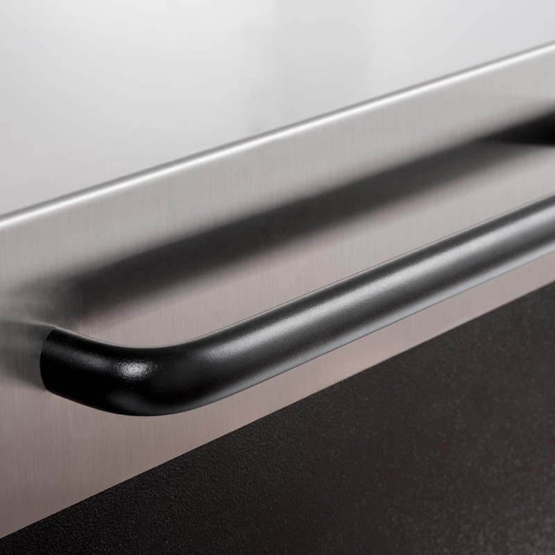 Close-up of a sleek black handle on a stainless steel appliance, highlighting modern kitchen design elements.