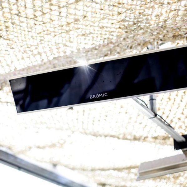 Bromic outdoor heater mounted on a ceiling, providing warmth in a shaded area.