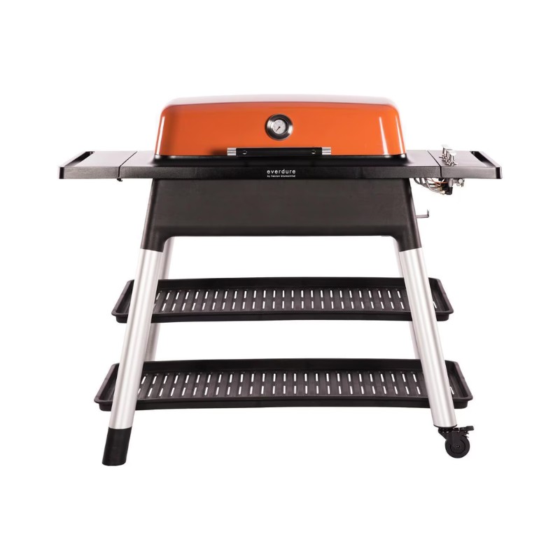 Everdure outdoor gas grill with orange lid and black body, featuring three storage shelves and wheels for mobility. Perfect for barbecuing and outdoor cooking.