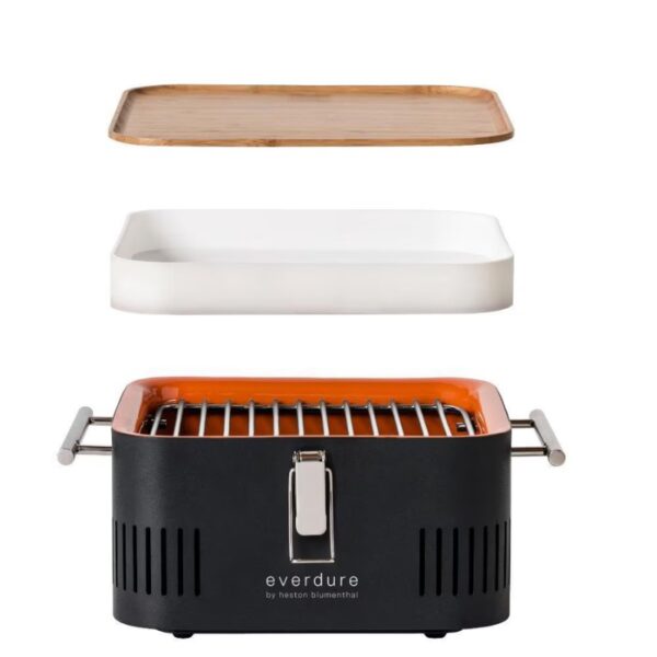 Everdure by Heston Blumenthal portable grill set featuring a black grill base, a removable white ceramic tray, and a bamboo serving tray on top. Ideal for outdoor cooking and entertaining.