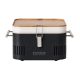 Everdure portable charcoal grill by Heston Blumenthal with a sleek black body and bamboo lid, designed for outdoor cooking.
