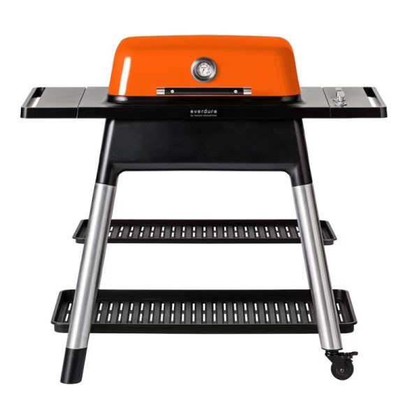 Everdure orange gas grill with a sleek black stand and two lower shelves, featuring a built-in thermometer for precise temperature control. Ideal for outdoor cooking and barbecues.