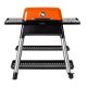Everdure orange gas grill with a sleek black stand and two lower shelves, featuring a built-in thermometer for precise temperature control. Ideal for outdoor cooking and barbecues.