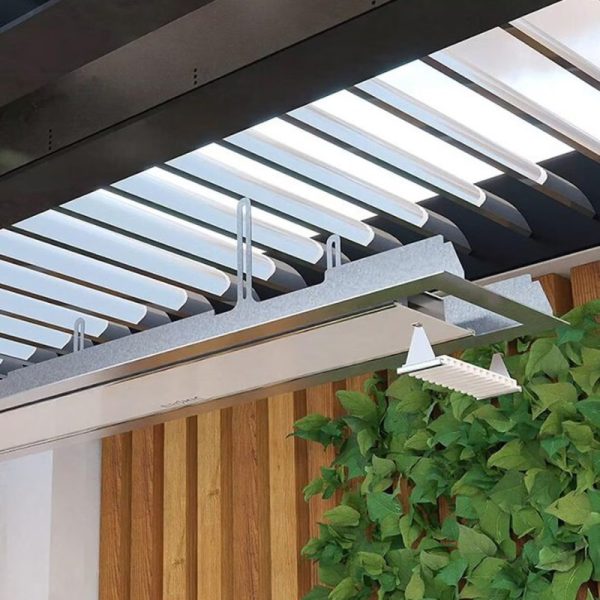 Modern pergola design featuring adjustable slats and integrated lighting, surrounded by lush greenery and wooden accents.
