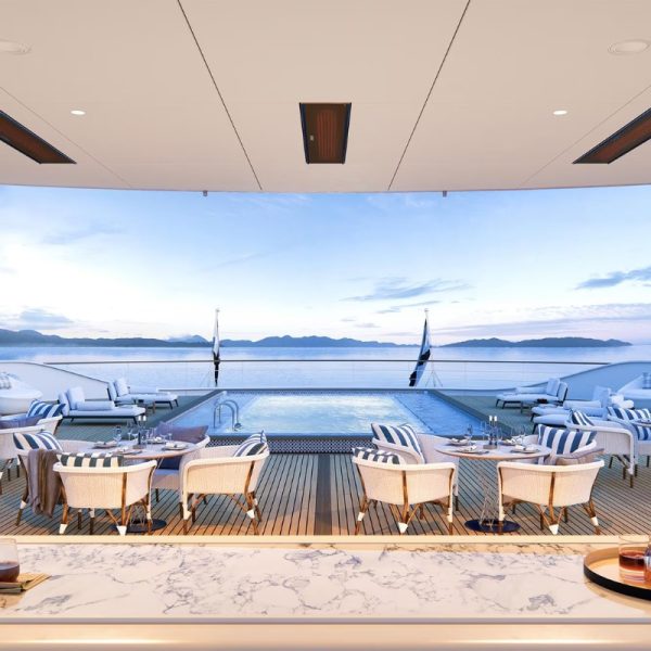 Luxury yacht deck with a swimming pool, stylish seating, and scenic ocean views at sunset.