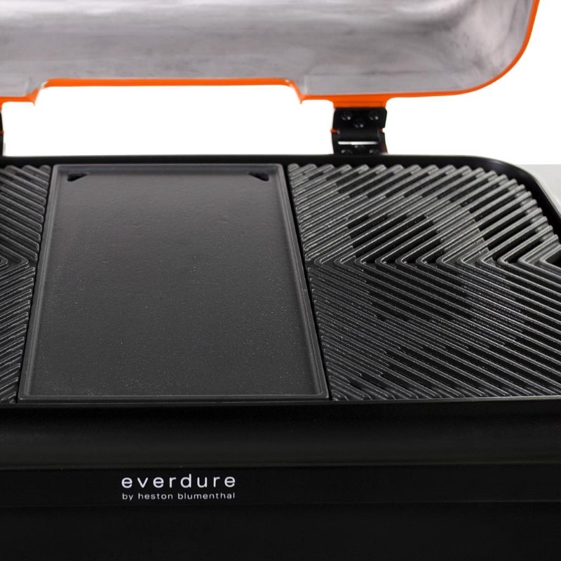 Everdure by Heston Blumenthal grill with a sleek black surface, featuring a removable cooking plate and distinctive textured design for optimal heat distribution.