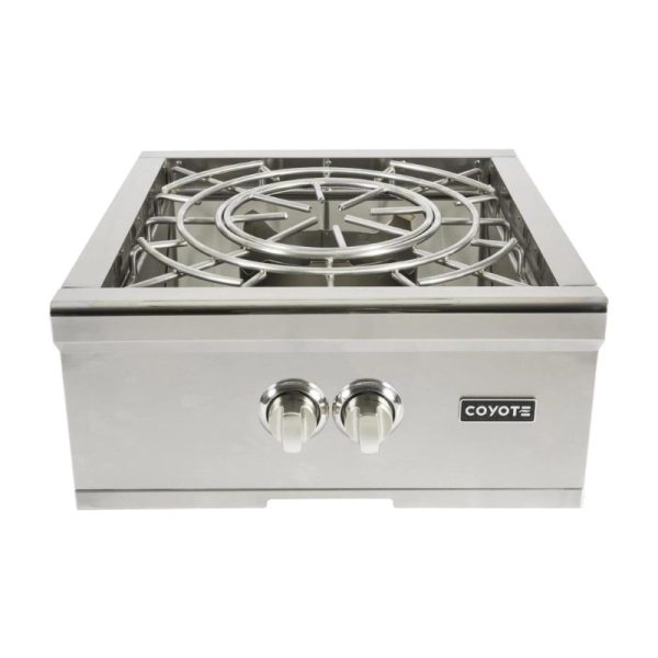 Coyote stainless steel outdoor gas burner with two control knobs and circular cooking grate, designed for efficient grilling and cooking.