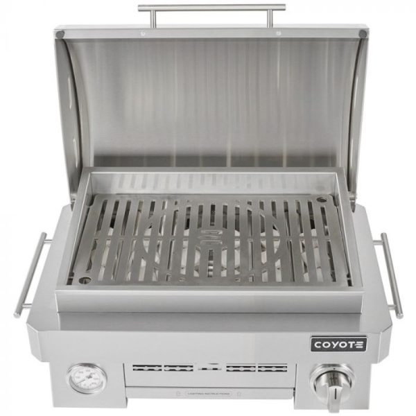 Coyote stainless steel gas grill with an open lid, featuring a spacious cooking surface and built-in thermometer for precise temperature control.