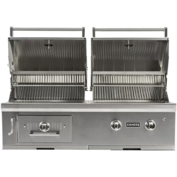 Stainless steel Coyote gas grill with dual cooking compartments and adjustable temperature controls, designed for outdoor grilling.