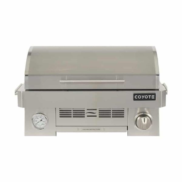 Stainless steel Coyote gas grill with a sleek design, built-in thermometer, and control knob for precise cooking. Ideal for outdoor grilling enthusiasts.