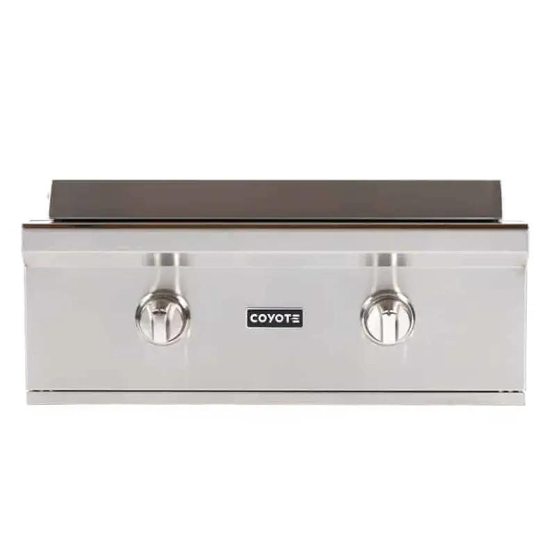 Coyote stainless steel gas grill with two control knobs and a flat cooking surface, ideal for outdoor cooking and grilling.