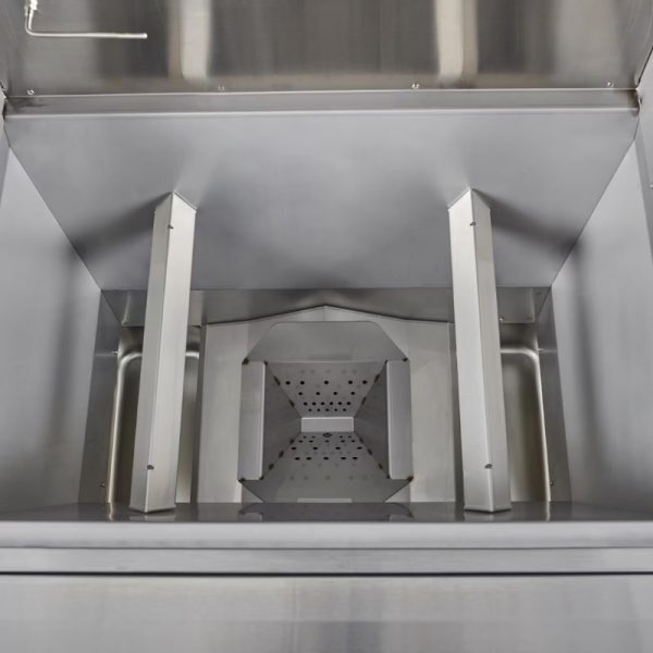 Stainless steel commercial kitchen equipment interior with a funnel-shaped component and drainage holes for efficient food processing.