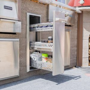 Stainless steel outdoor kitchen storage cabinet with pull-out shelves and various spice jars, enhancing organization and accessibility.