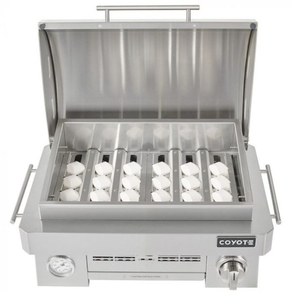 Stainless steel Coyote grill with lid open, featuring multiple burners and a built-in thermometer for precise cooking.