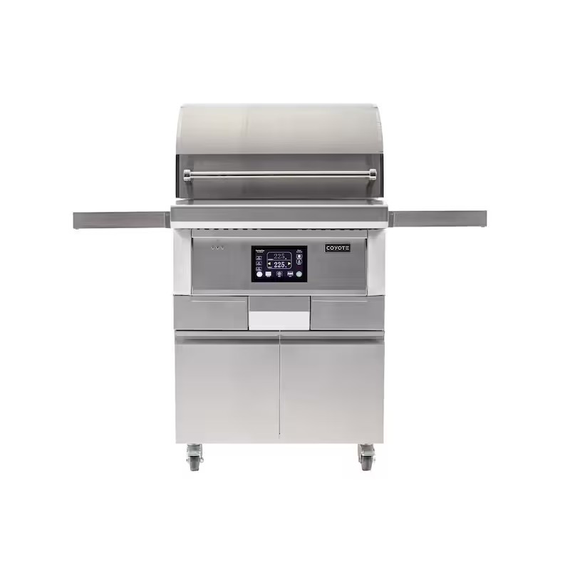 Stainless steel Coyote outdoor grill with digital control panel, side shelves, and storage drawers, ideal for backyard cooking.