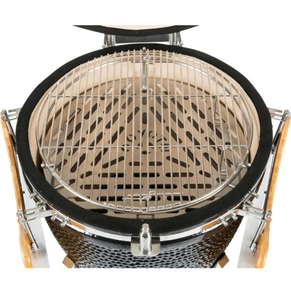 Top view of a high-quality charcoal grill featuring a stainless steel cooking grate and a ceramic body, designed for optimal heat retention and grilling performance.