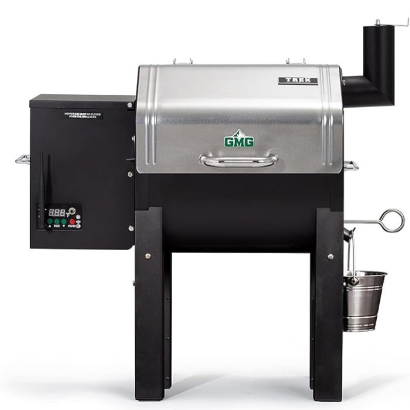 GMG Trek pellet grill with digital control panel, stainless steel lid, and side smoke stack, ideal for outdoor grilling and smoking.