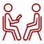 Two stylized figures sitting in chairs engaging in a conversation or interview, representing communication and dialogue.