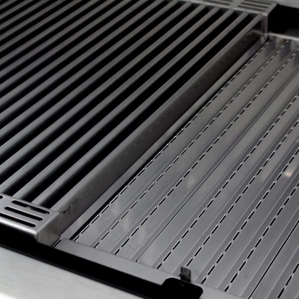 Close-up of a stainless steel grill surface featuring ridged and flat cooking areas, ideal for grilling various foods.