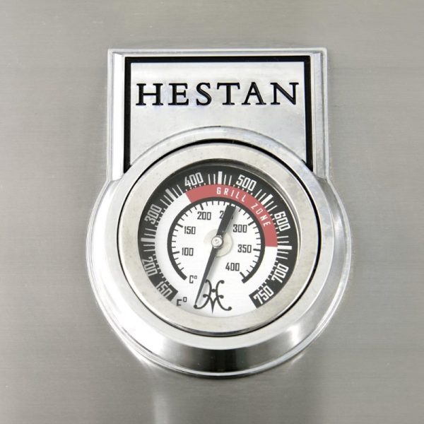 Hestan grill thermometer displaying temperature readings from 0 to 750°F, with a focus on the grill zone indicator.