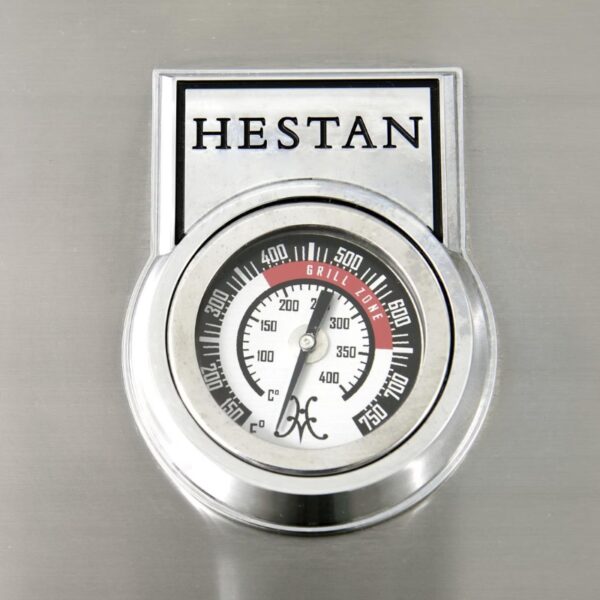 Hestan grill thermometer displaying temperature range from 100°F to 750°F, indicating optimal grilling zones.