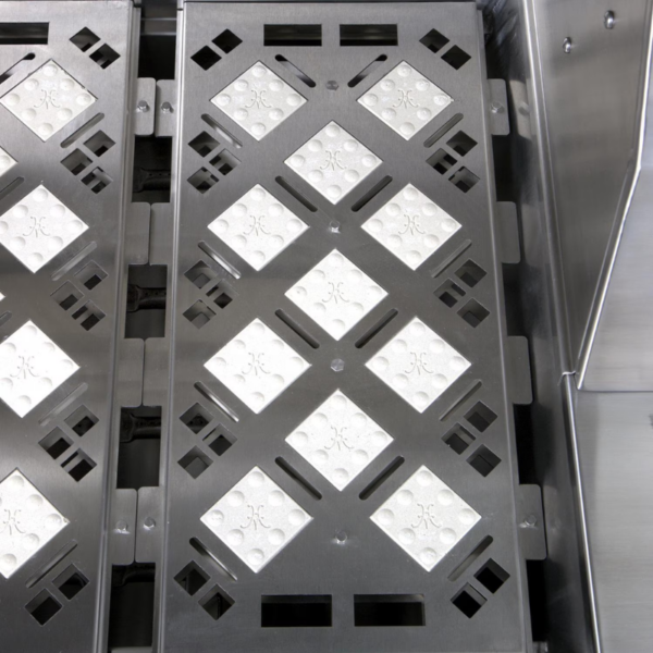 Stainless steel grill grates featuring a diamond pattern with raised surfaces for improved heat distribution and cooking efficiency.