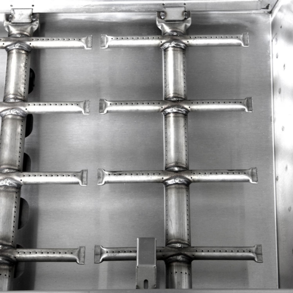 Close-up of stainless steel gas burners arranged in a grid pattern, showcasing their design and functionality for grilling or cooking.