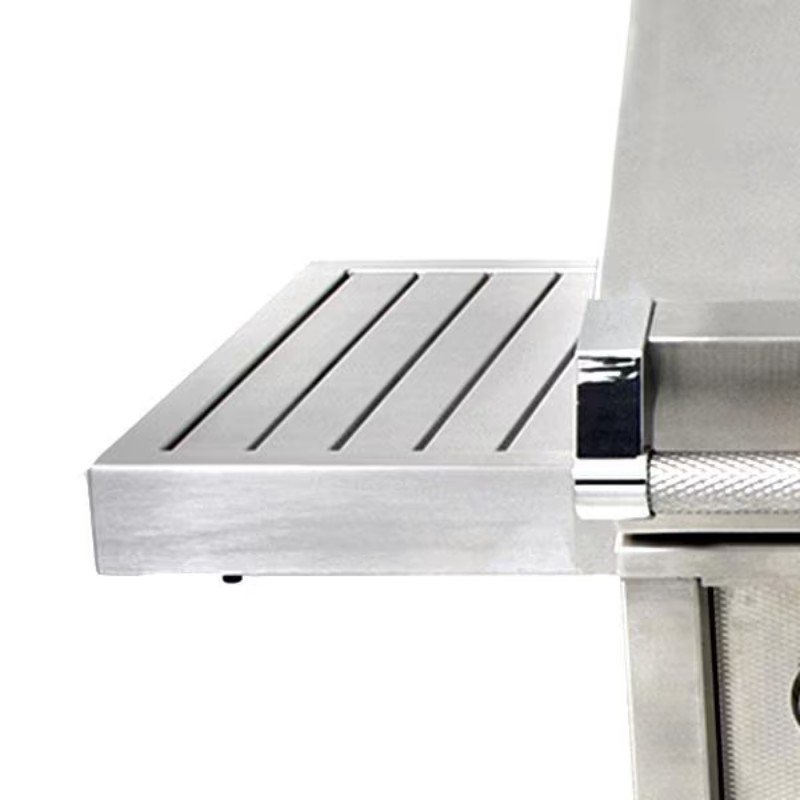 Stainless steel countertop with slotted surface, ideal for food preparation and grilling.