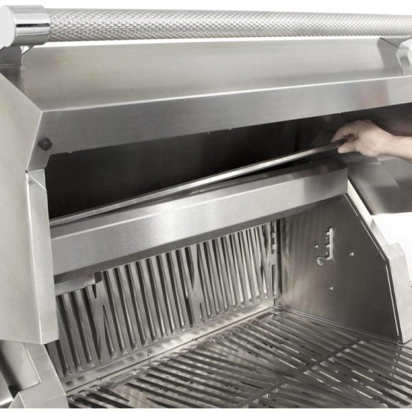 Stainless steel grill interior with a hand adjusting a removable cooking grate.