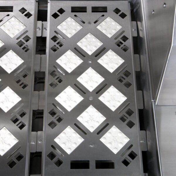 Stainless steel equipment with diamond-patterned trays designed for industrial use, showcasing durability and efficient drainage.