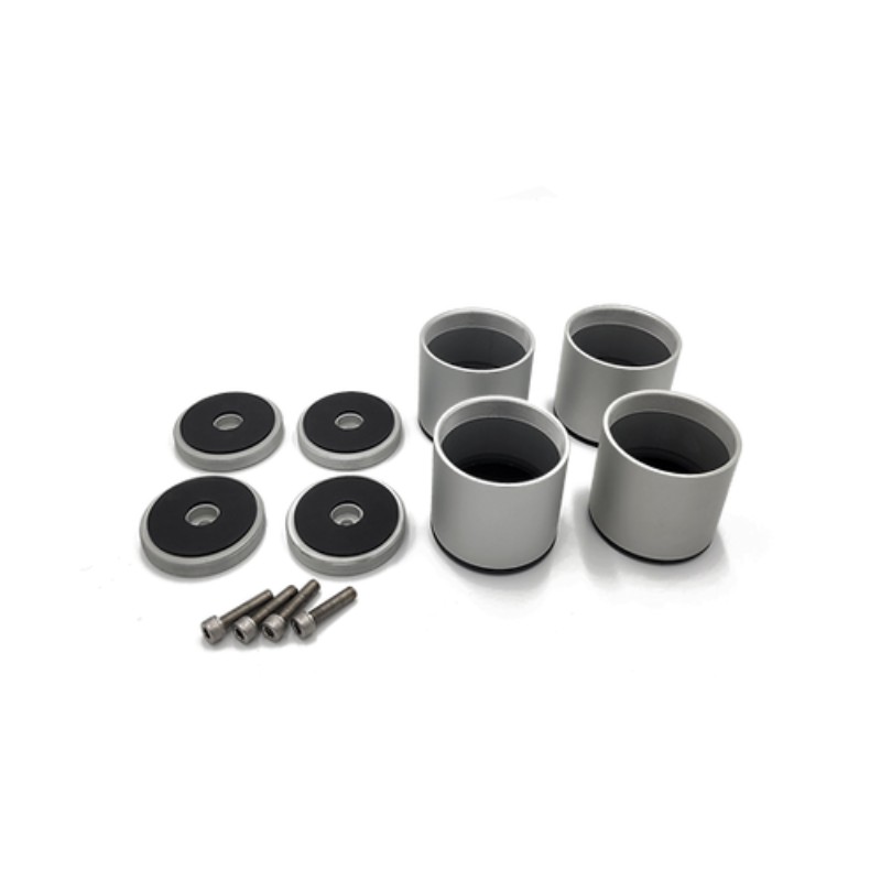 Set of aluminum spacers with rubber pads and screws for automotive or machinery applications.