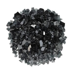 Black glass chips arranged in a circular formation, showcasing their reflective surfaces and irregular shapes, ideal for decorative use in landscaping or crafts.