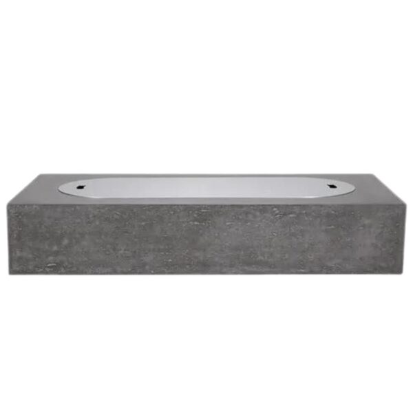 Modern rectangular concrete bathtub with a sleek white interior, ideal for contemporary bathrooms.