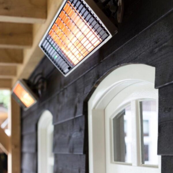 Infrared heating panels mounted on a wooden wall, providing efficient outdoor heating for patios or decks.