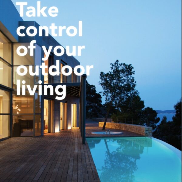 Modern home with large glass windows overlooking a serene pool and outdoor living space, emphasizing outdoor lifestyle and design.