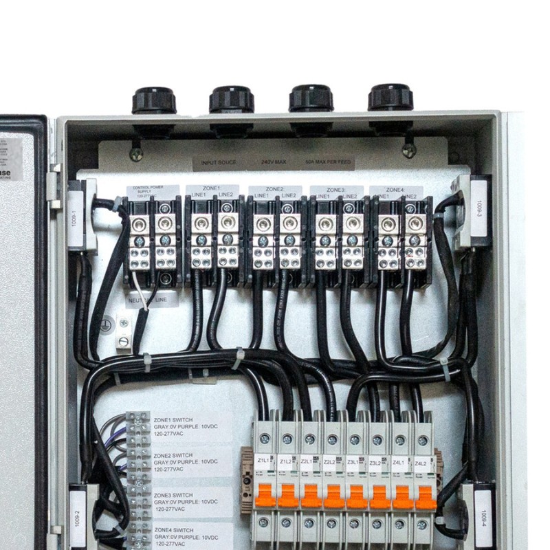 Electrical control panel with multiple zones, featuring terminal blocks, switches, and labeled connections for efficient wiring management.