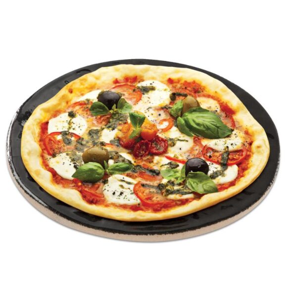 Delicious Margherita pizza topped with fresh mozzarella, tomatoes, olives, and basil on a black plate.