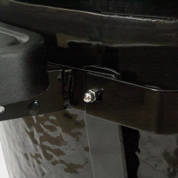 Close-up of a black metal container with a handle and a threaded bolt, showcasing its sturdy construction and design features.
