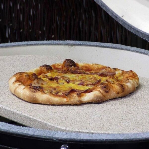 Freshly baked pizza with a golden crust and melted cheese on a cooking stone, showcasing its delicious toppings.
