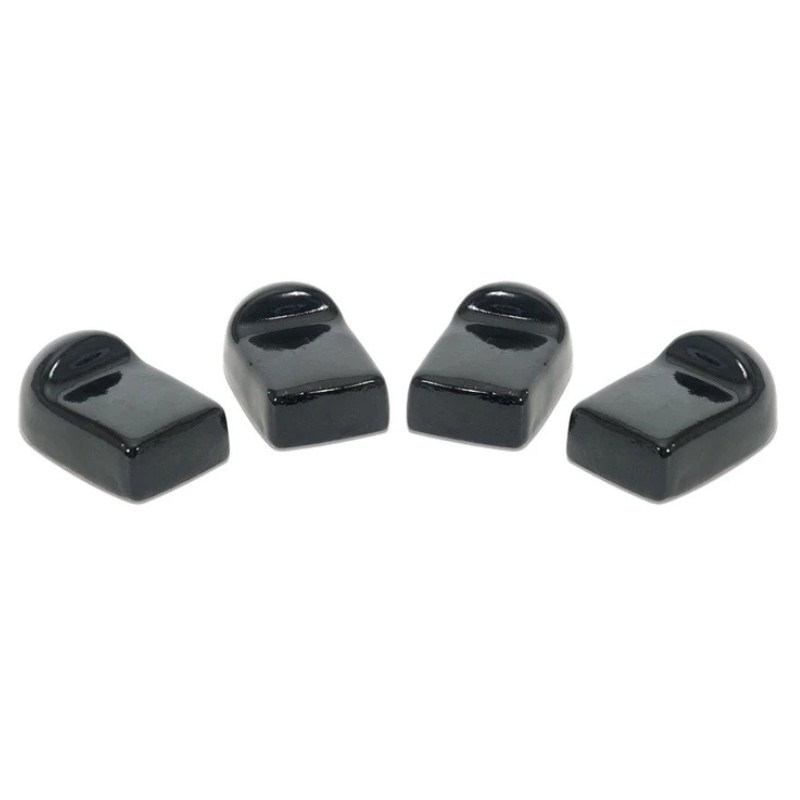 b8684f31-4482-44b0-80d5-c19a0353da63.jpg Four black ceramic shoe-shaped figurines arranged in a row, ideal for decorative purposes or as unique collectibles.